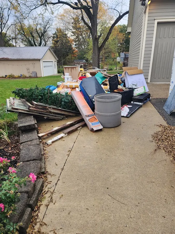 Dumpster being loaded with debris for Commercial Dumpster Rental in West Earl